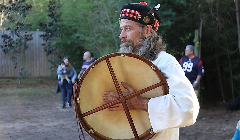 A drummer keeps the beat while others dance a medieval dance in Todd Mission, Texas.