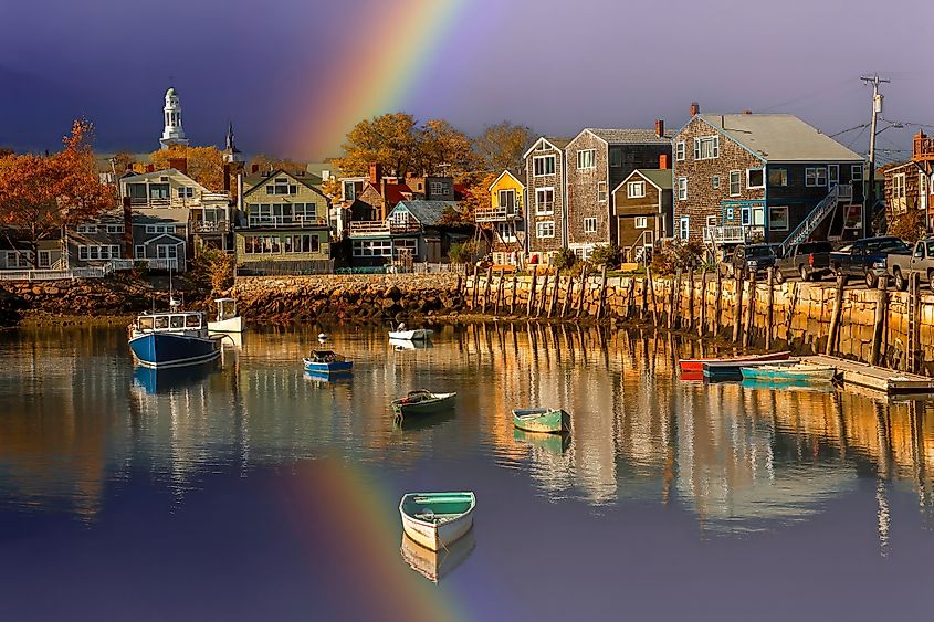 Fishing boat harbor in Rockport, Massachusetts, with the First Congregational Church clock tower visible in the background. Rockport is a town in Essex County.