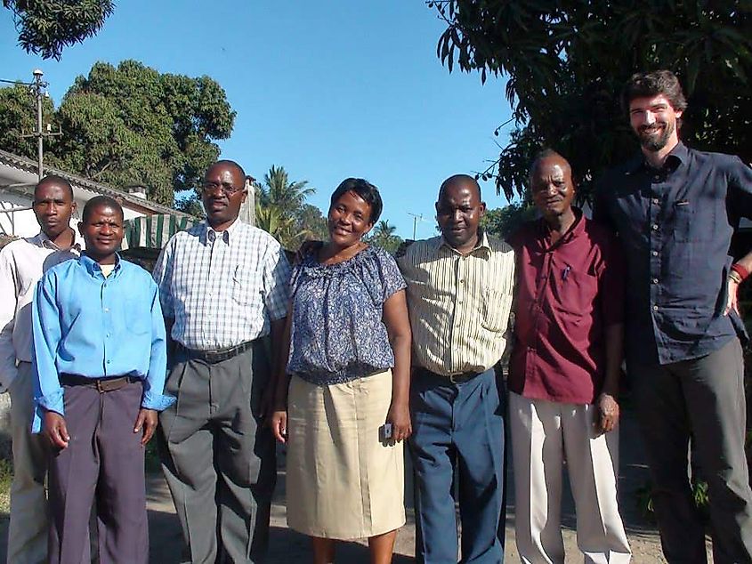 Local staff of Awaken Mozambique with a management committee member. Image Credit Awaknos via Wikimedia.