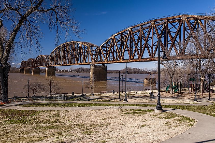 Sunny view of a large railroad truss bridge over the Ohio River between Henderson, KY, and Indiana. 