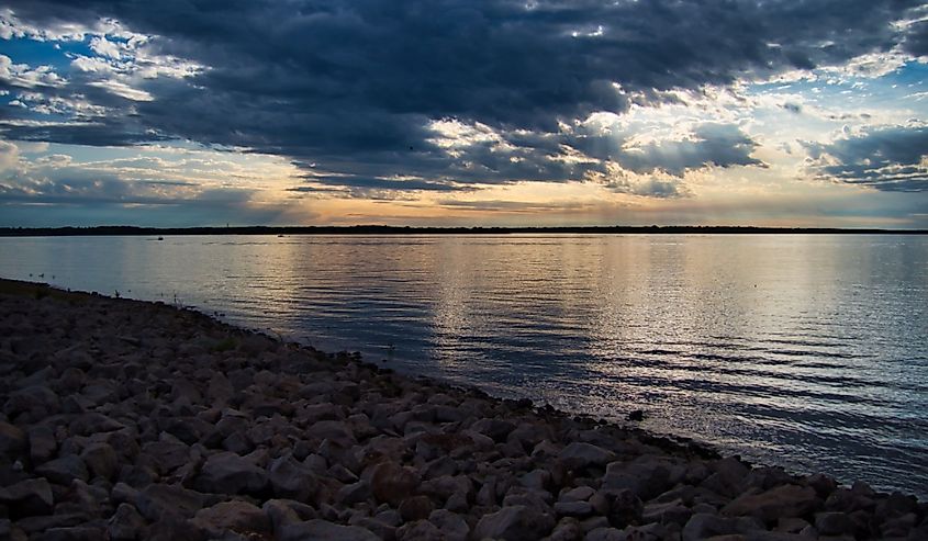 The scenic Hillsdale Lake and its rocky coast at sunset in Kansas