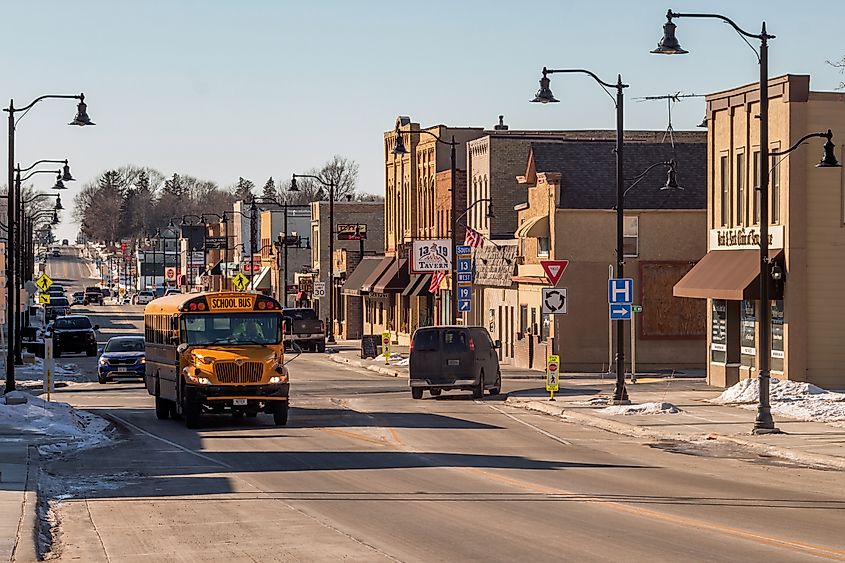 A school bus passes through downtown New Prague, Minnesota.