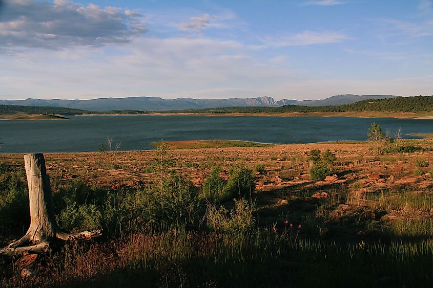 Late afternoon sun settling in over Lake Heron in New Mexico with views of the mountains in the distance. 
