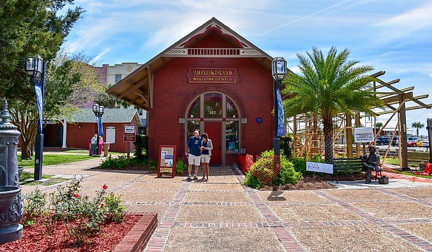 A couple standing in front of the Welcome Center at Amelia Island, Florida,