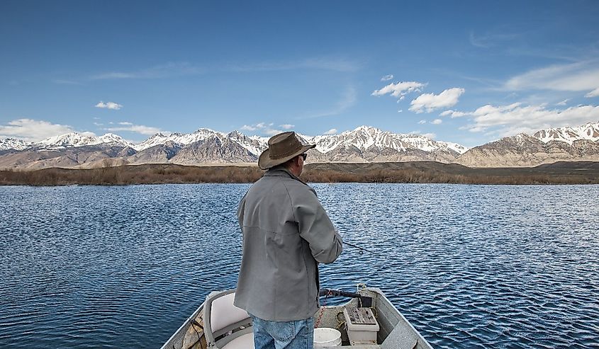 Man in a boat fishing on the Mackay Reservoir, Idaho