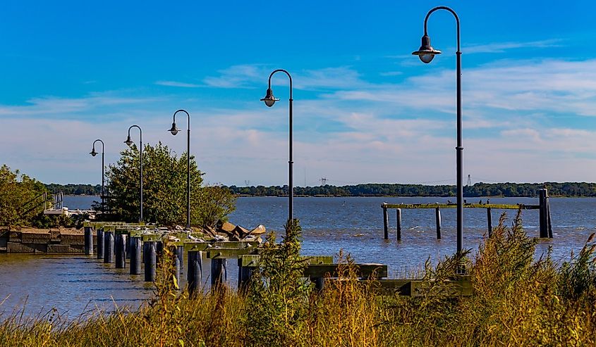 A damaged dock and pier stand in the Delaware River, New Castle, Delaware.