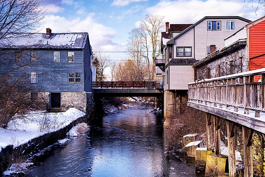 Old buildings over the Williams River in WestStockbridge in winter.
