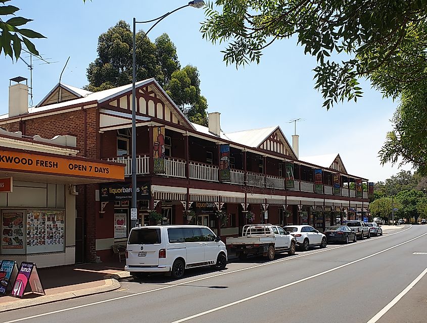 Street view of historic buildings in Bridgetown, Australia, featuring local shops and restaurants along the main road, showcasing the town's classic architecture and charm.