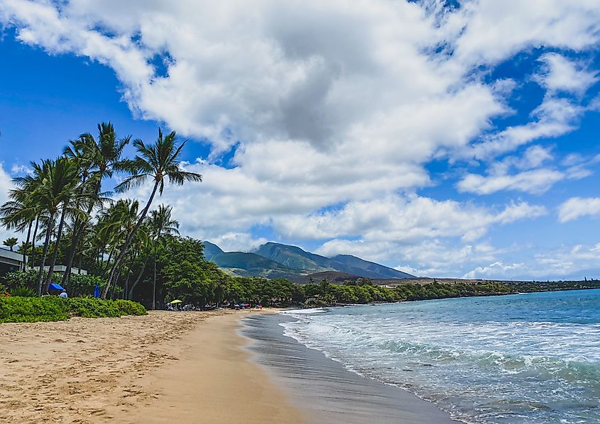 Kaanapali Beach, Maui, Hawaii. Beautiful sunny beach day with mountains in the background.