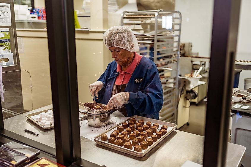 Lititz, PA USA - November 16, 2019: A candy maker prepares confections at the Wilbur Chocolate Factory Store.