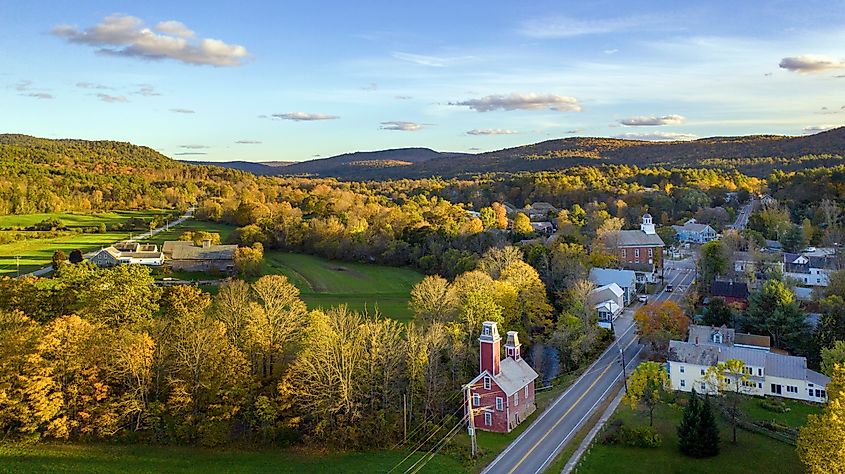 Aerial view of Chester, Vermont, showcasing the vivid fall colors across the landscape.