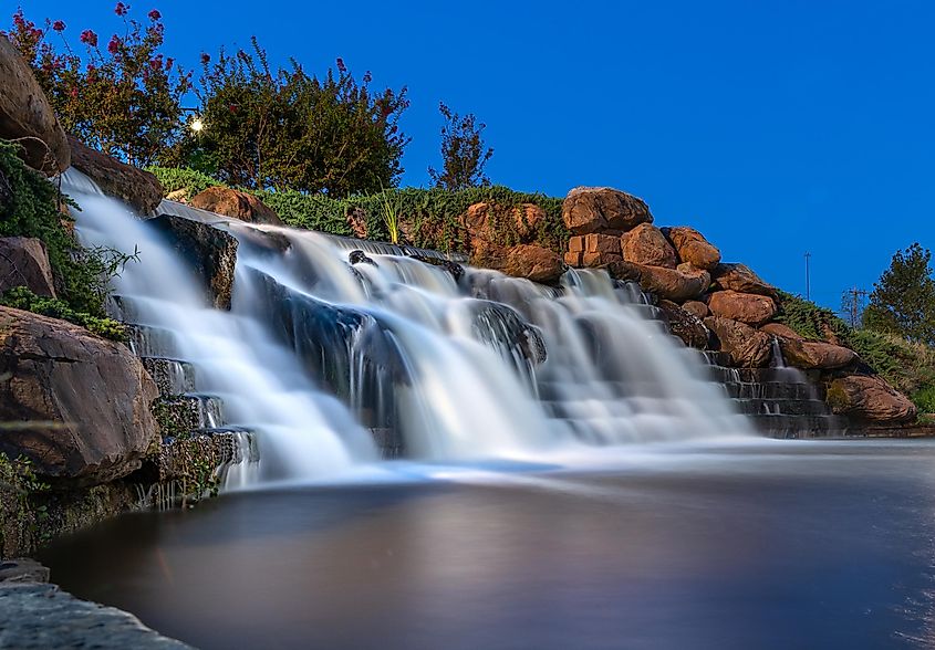 Waterfall in Oklahoma City park after sunset.