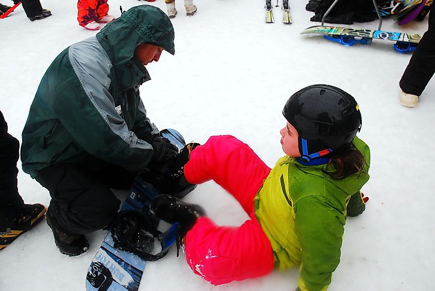 A ski instructor assists a young girl in Vernon, New Jersey