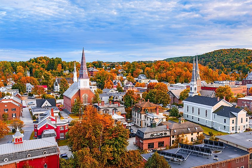 Montpelier, Vermont, USA, showcasing the town skyline amidst vibrant autumn foliage.