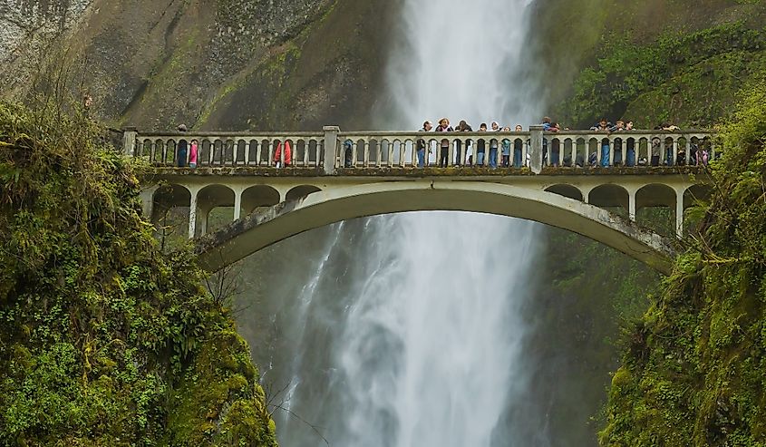 A group of school children on the trail bridge over Multnomah Falls in the Columbia River National Scenic Area in Troutdale, Oregon.