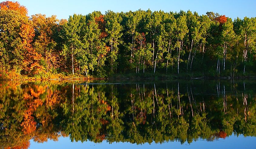 Beautiful fall colors reflect off a pond at Kettle Moraine State Forest in Wisconsin