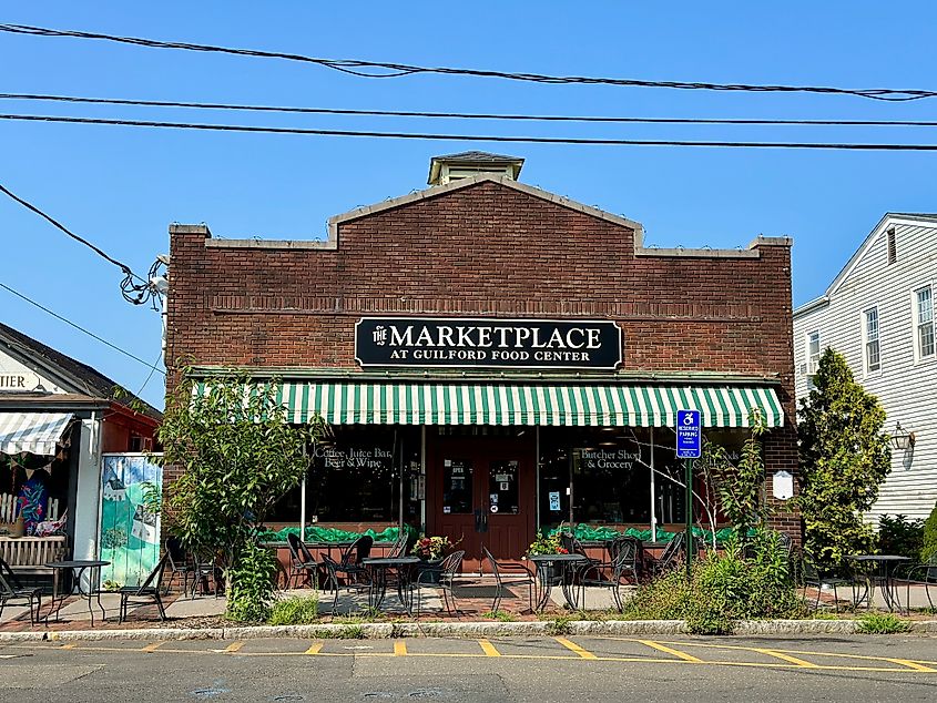 Exterior of The Marketplace at Guilford Food Center, an old red brick building in Guilford, Connecticut