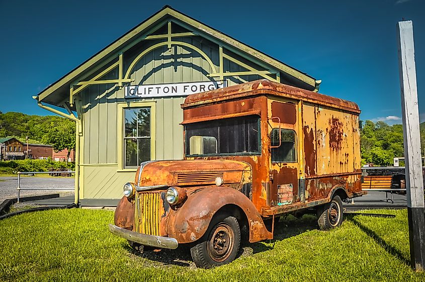 Rusty vintage truck displayed outside Clifton Forge station at the C&O Railway Heritage Center.