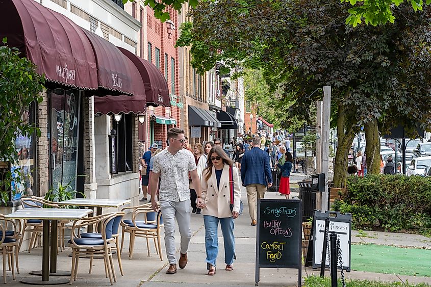 People walking on the sidewalk in downtown Saratoga Springs, New York.