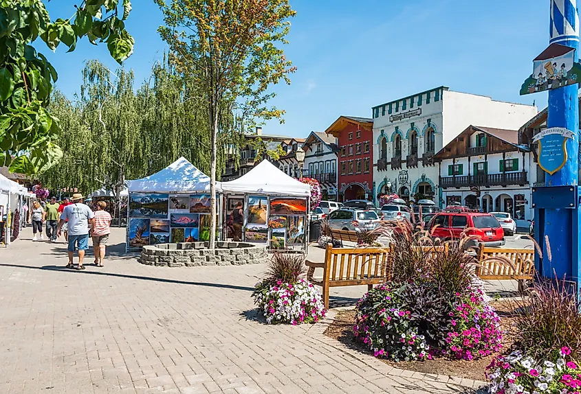 Main tourist street with art show and Bavarian style buildings in Leavenworth, Washington.