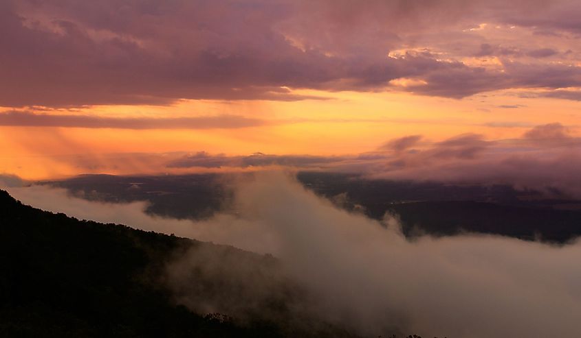 A beautiful, foggy, dramatic sunrise at Mount Magazine located in Paris, Arkansas