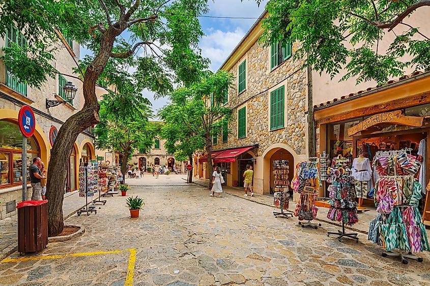A tree-lined street in Valldemossa, Spain.