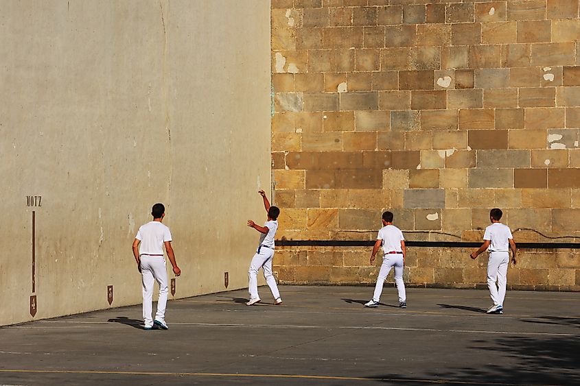 Four young men playing Basque Pelota