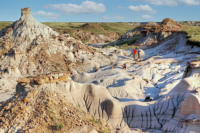 tourists explore Dinosaur Provincial Park in Alberta, Canada,