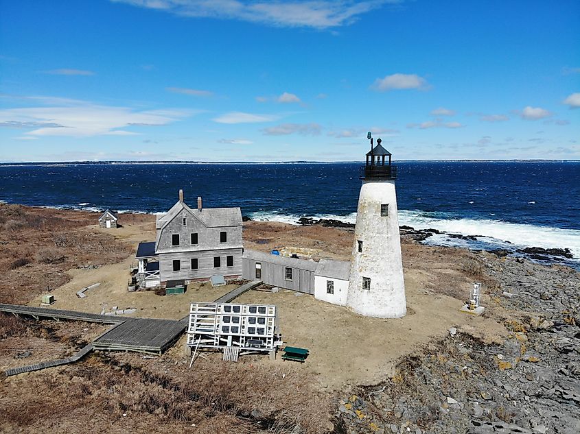 Aerial drone views of Wood Island Lighthouse on Wood Island in Biddeford Maine.