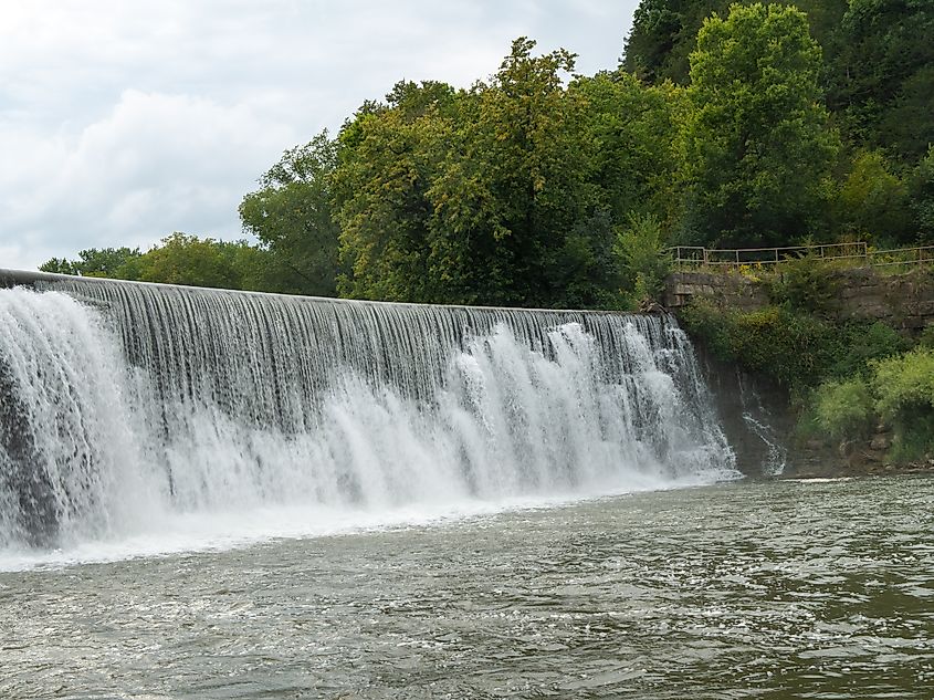 Mist rises from a Weir waterfall on the Root River in Lanesboro, Minnesota