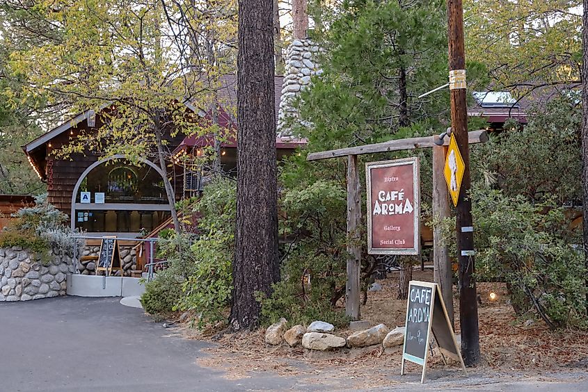 View of the Aroma Cafe restaurant and signs by the street in Idyllwild, California. Editorial credit: Rosamar / Shutterstock.com