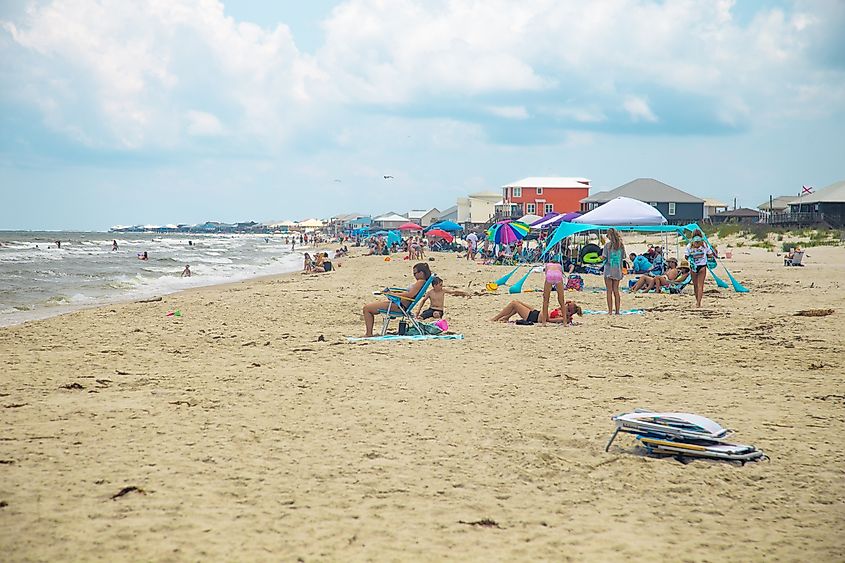 A busy day at the beach in Dauphin Island, Alabama. Editorial credit: HarrisonJeffs / Shutterstock.com.