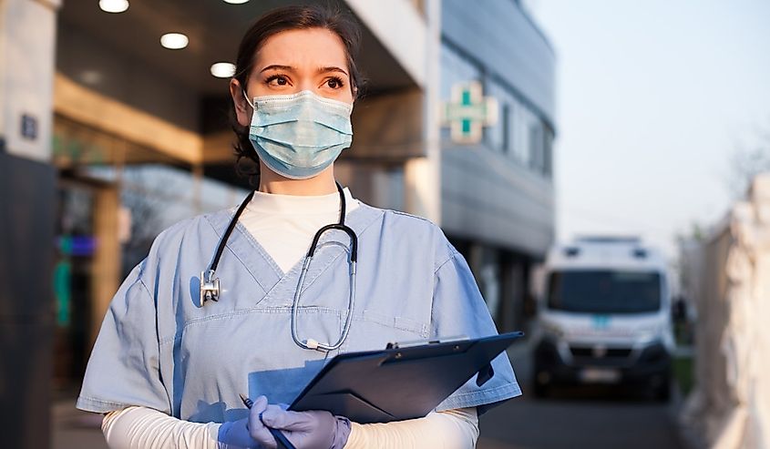 Young female EMS key worker doctor.