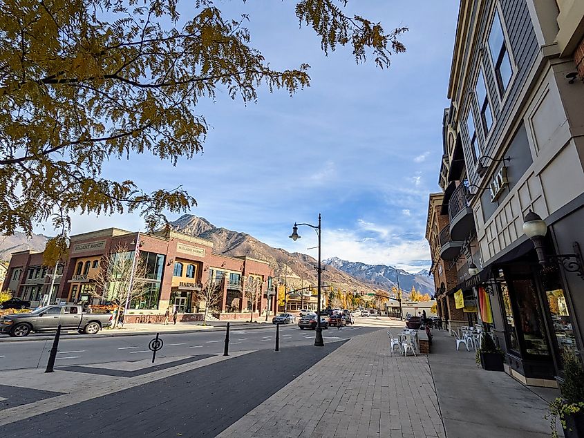 Holladay Village in downtown Holladay, Utah, featuring a charming mix of shops, restaurants, and community spaces with a scenic mountain backdrop