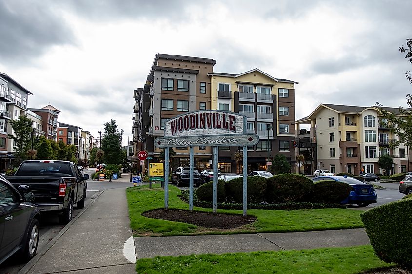 Woodinville, WA USA - Street view of the city center sign outside of a major shopping area on a cloudy, overcast day.