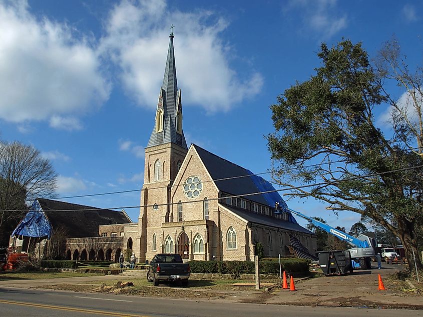 Trinity Episcopal Church on Dauphin Street in Mobile, Alabama, showing damage to the sanctuary roof and front wall of the fellowship hall following the Christmas Day tornado.