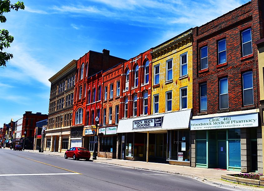 Colorful building in the main street with stores signs and blue sky downtown Woodstock Ontario, Canada. Editorial credit: Ali Jabber / Shutterstock.com