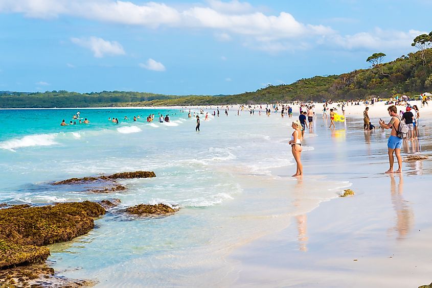 People enjoying the sunny weather at Hyams Beach