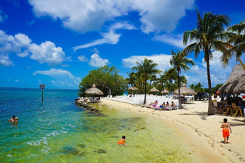 People relaxing by a beach in Key Largo, Florida.