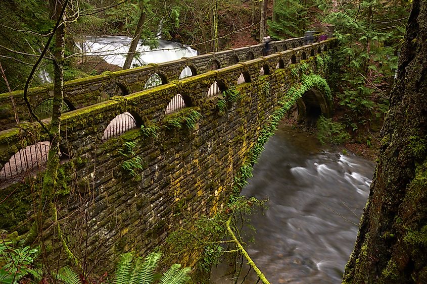 Whatcom Creek and the historic stone bridge crossing it. Bellingham, Washington.