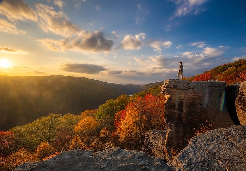 Hiker in Cooper's Rock State Forest in peak fall in West Virginia