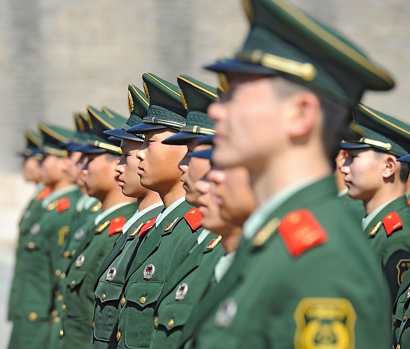 Chinese soldiers attend a parade at Tiananmen Square on November 8th, 2012. Credit Shutterstock: Hung Chung Chih.