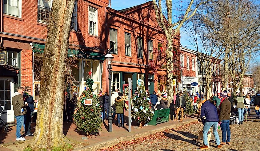 People enjoy walking and shopping in the stores of downtown Nantucket, Massachusetts near the Christmas holiday season