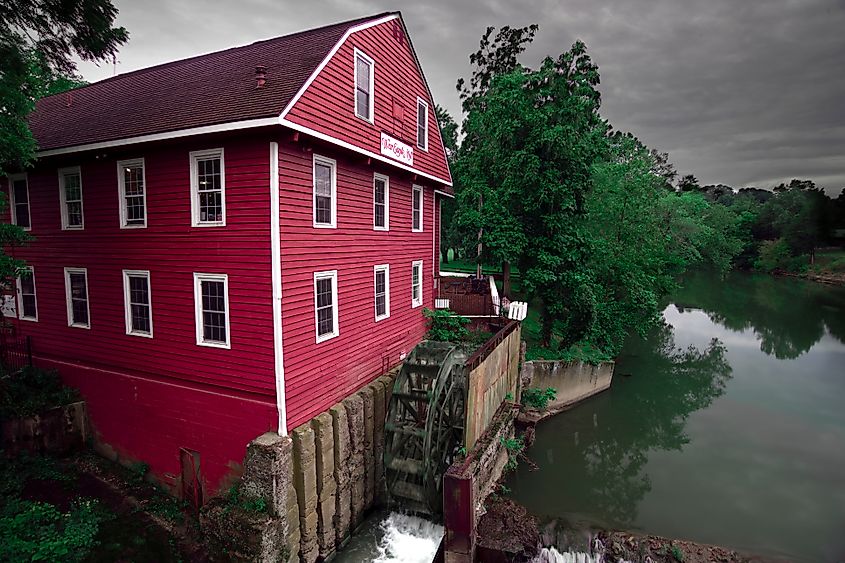 Historic War Eagle Mill on War Eagle River on cloudy morning