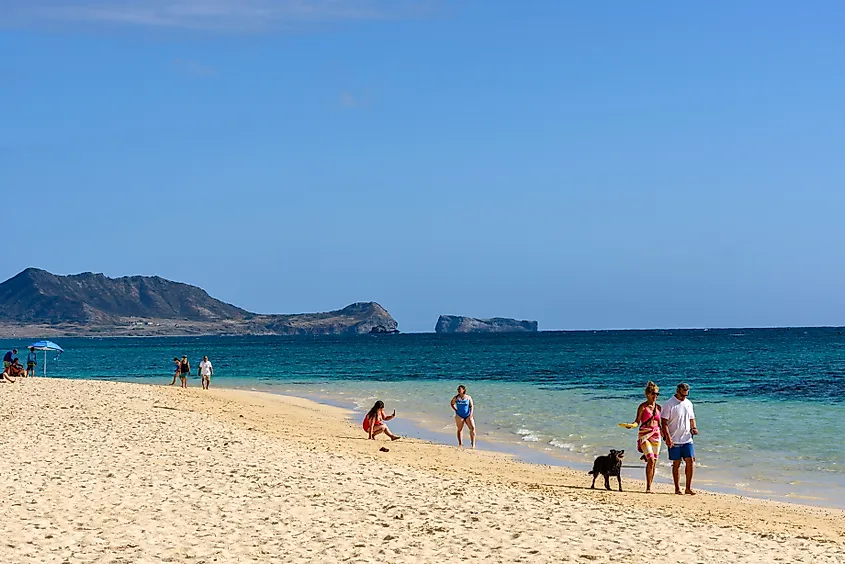 People along Lanikai Beach in the town of Kailua, Hawaii. Editorial credit: Malachi Jacobs / Shutterstock.com