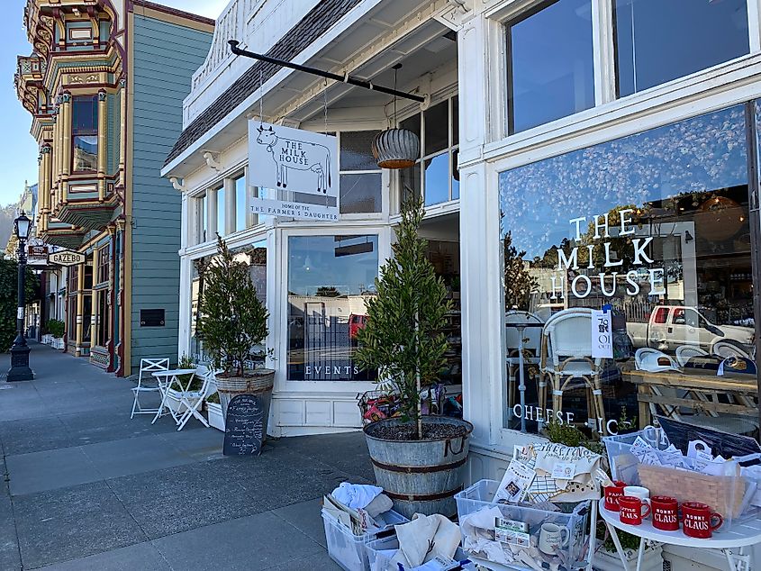 A boutique shop and creamery called The Milk House stands next to a gingerbread mansion on Ferndale's Historic Main Street.