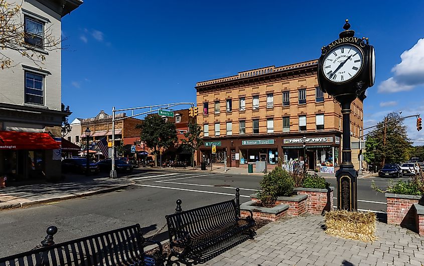 A huge clock in the main street of Madison, New Jersey downtown on a sunny afternoon.