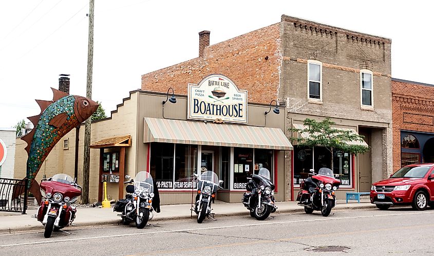 Five motorcycles parked in front of the Boathouse Restaurant on the main street in Battle Lake, Minnesota.