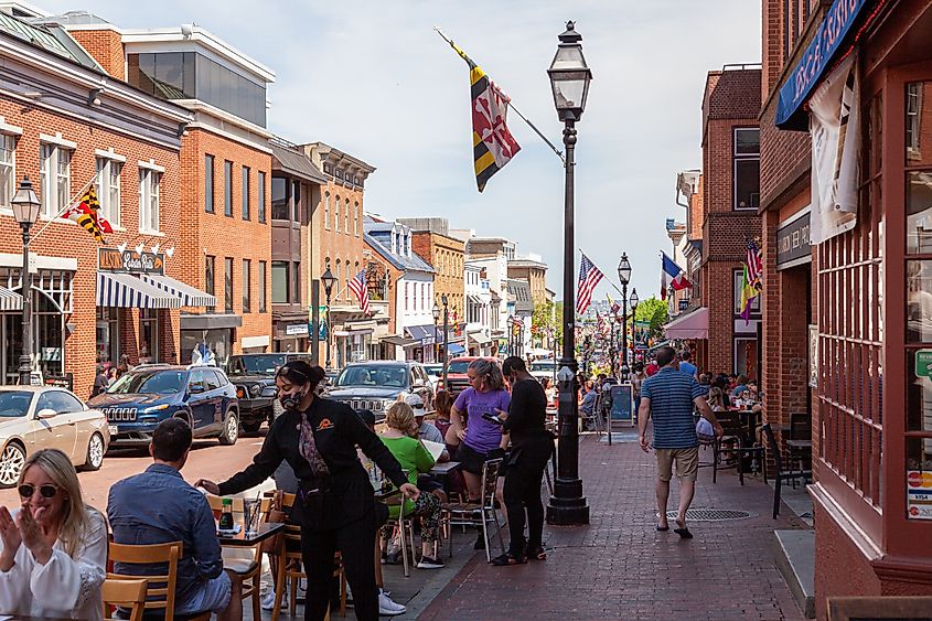 Street view of Annapolis, Maryland, with people walking in historic town.