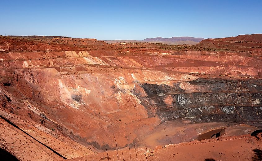 Active deep pit of red iron ore mine in Pilbara region in Western Australia.